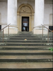 Quavers roll on steps in front of columns and doorway