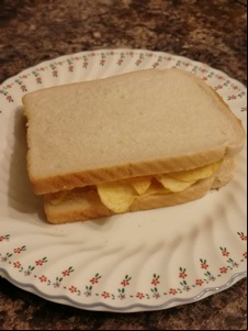 White bread potato crisp sandwich on a plate