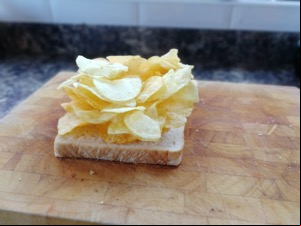 Crisps piled onto white bread