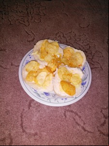 Flash photo of crisps on open bread rolls
