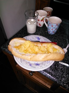 Flash photo of baguette filled with potato crisps