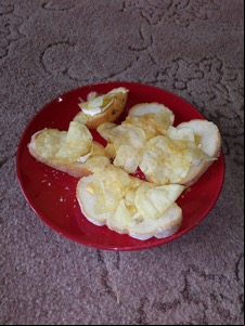 Several slices of bread topped with crisps and brie