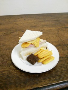 Frazzles and ham in a tiny crustless sandwich