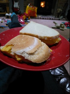 Two sandwiches containing crisps and Frazzles
