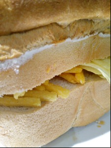 Close-up of Chipsticks and crisps in a loaf