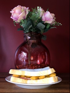 Scampi Fries and salami sandwich alongside vase