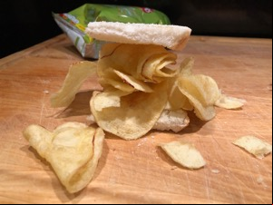 White sliced bread overflowing with potato crisps