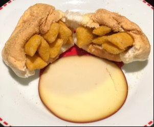 White roll containing Scampi Fries torn in half