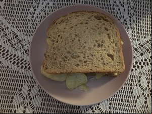 Brown crisp sandwich in partial shadow
