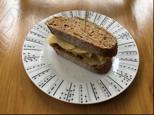Small brown crisp sandwich with cocktail stick