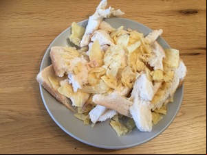 Chaotic pile of bread and crisps