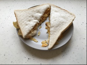Diagonally-sliced white crisp sandwich