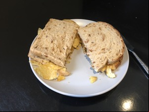 Brown crisp sandwich cut in half