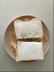 Overhead view of halved white crisp sandwich